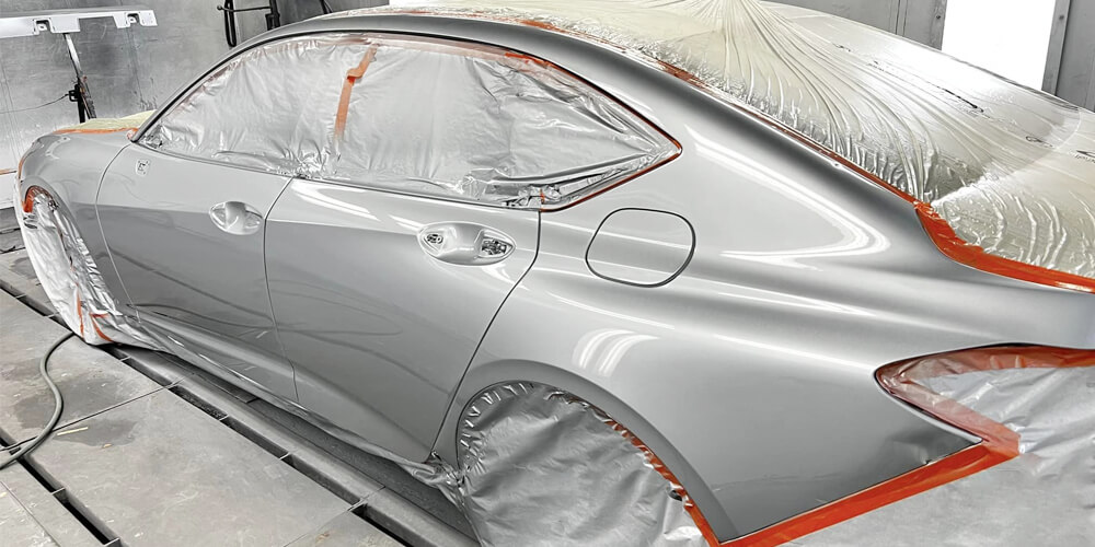 What Is a Clear Coat Car Paint and Why Does It Matter? 1 lose-up showing glossy finish of Clear Coat Car Paint on red vehicle