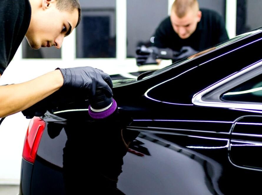 Close-up of buffer machine during Professional Car Polishing on car paint surface