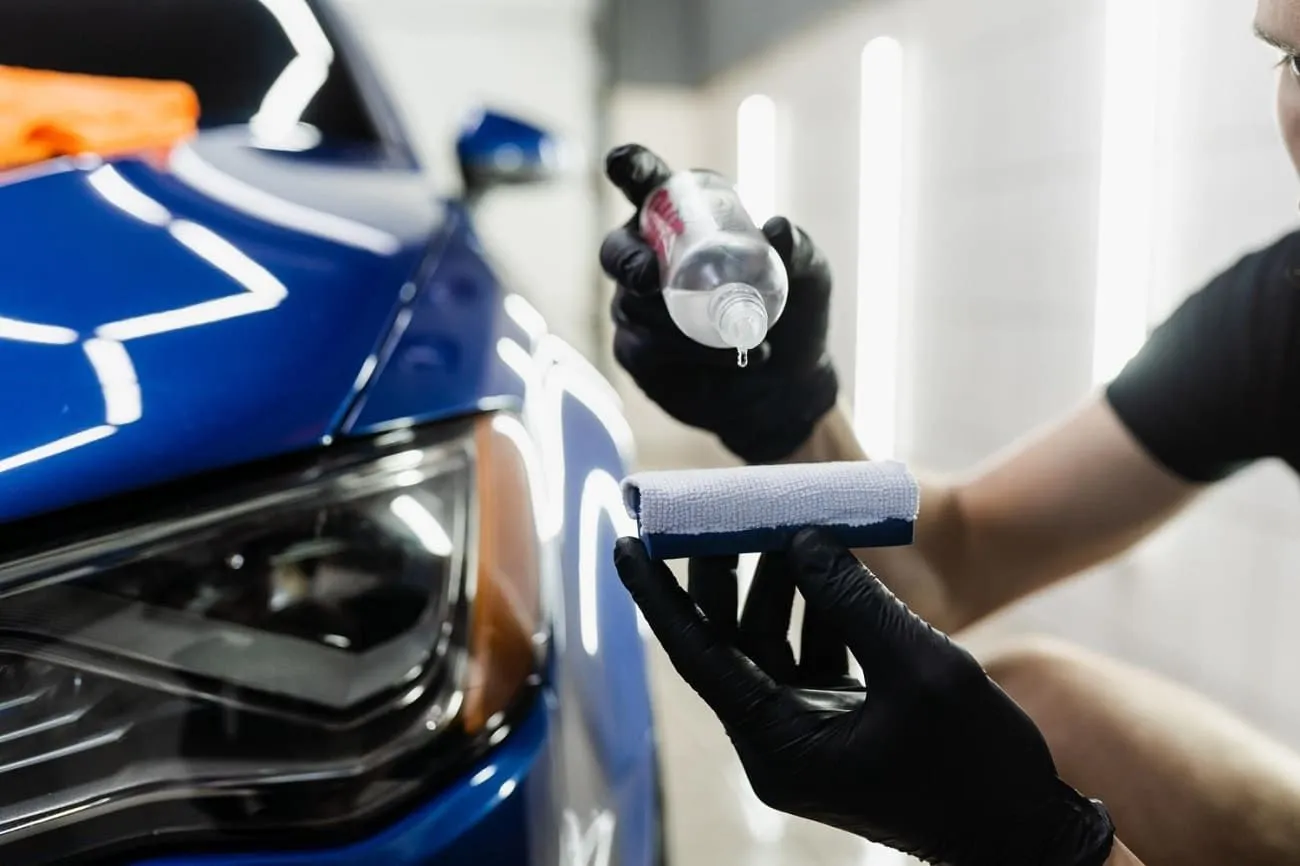 Technician applying Mobile Ceramic Coating Service on car hood