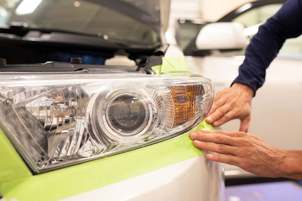 What Is On-Site Headlight Restoration? 1 Technician performing On-Site Headlight Restoration on cloudy lens